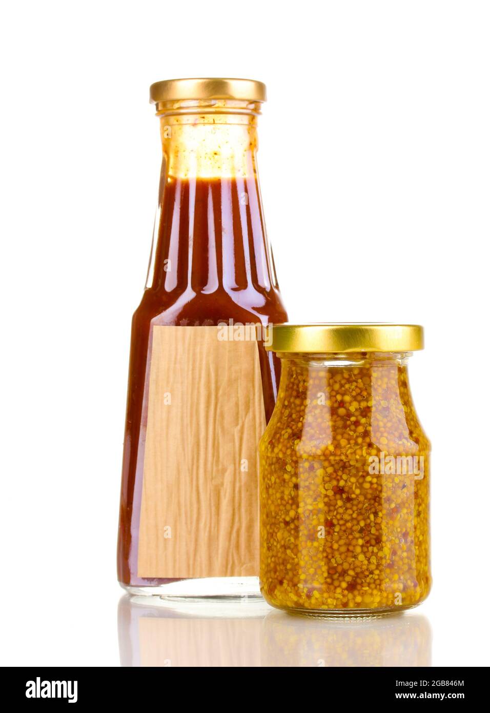 Tomato sauce and mustard in glass bottles isolated on white Stock Photo