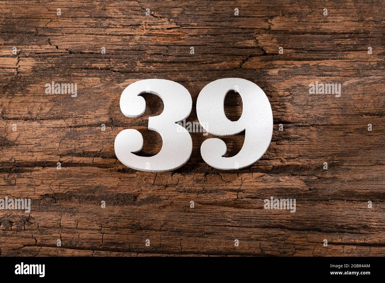 thirty nine 39 - White wooden number on rustic background Stock Photo