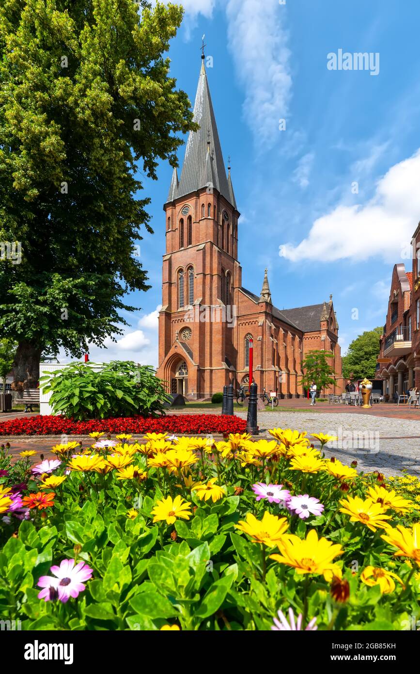 Nikolaikirche with flower in foreground in Papenburg, Germany Stock Photo