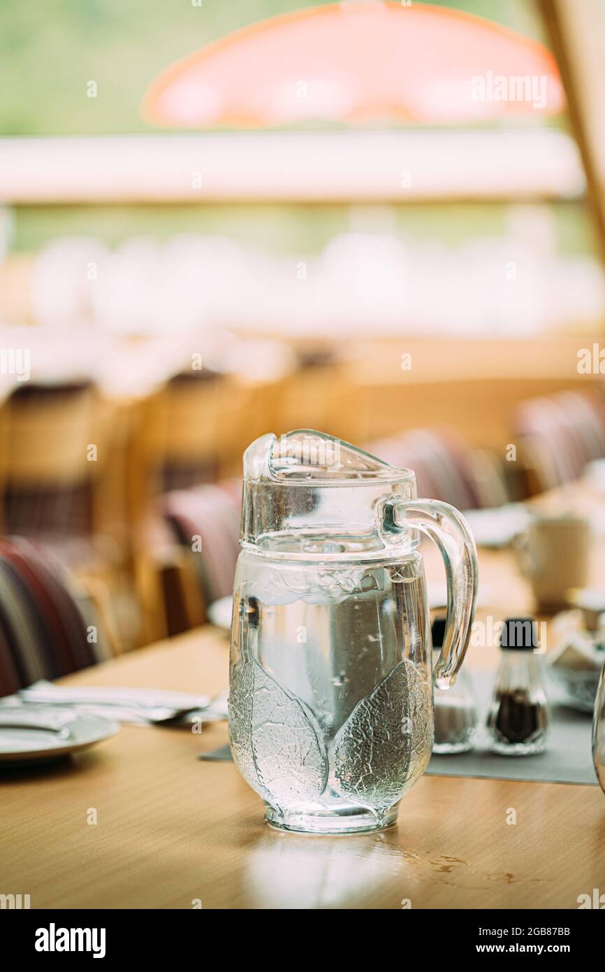 Cozy Interior Of Summer Cafe. Jug Of Icy Cold Ice Water On Table And ...