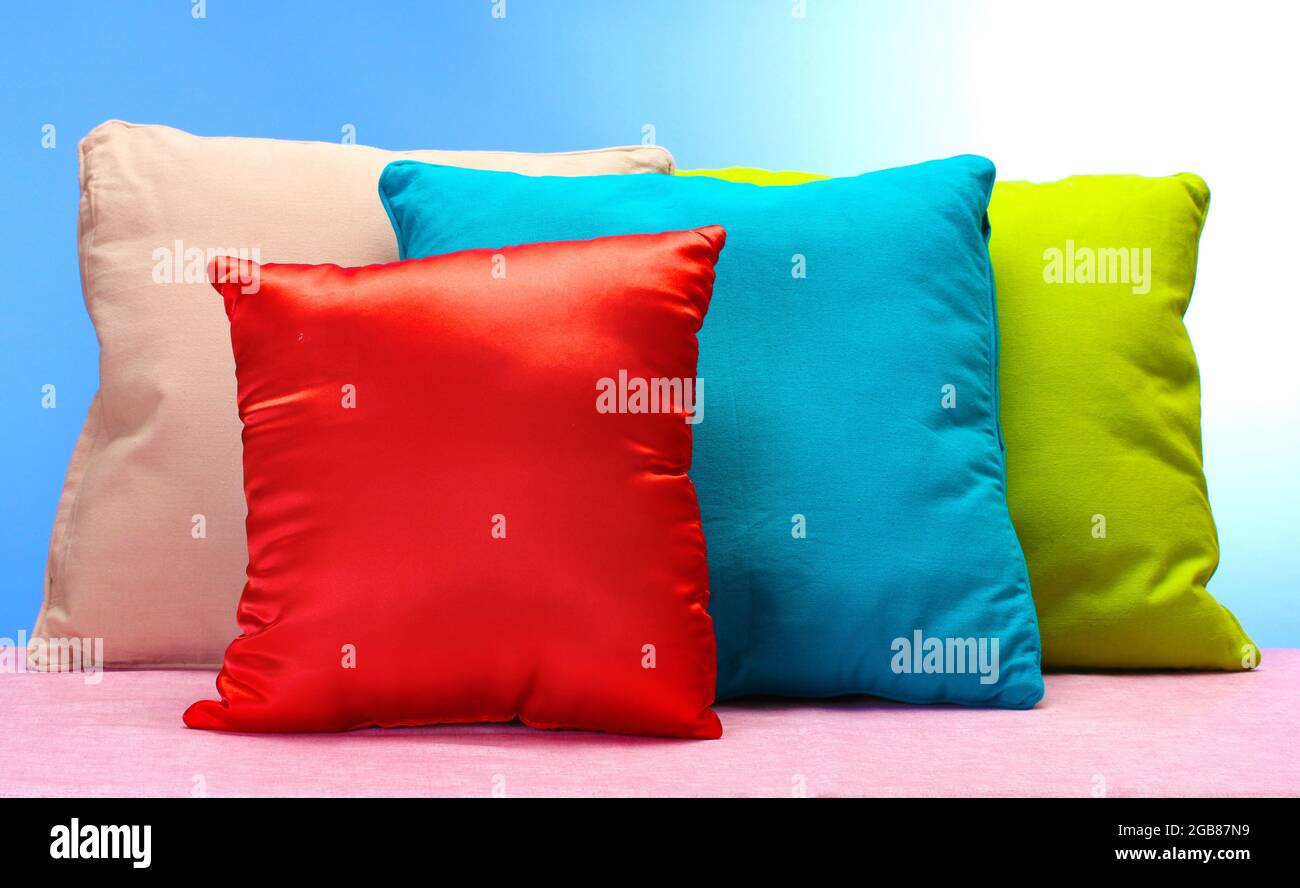 bright pillows on blue background Stock Photo Alamy