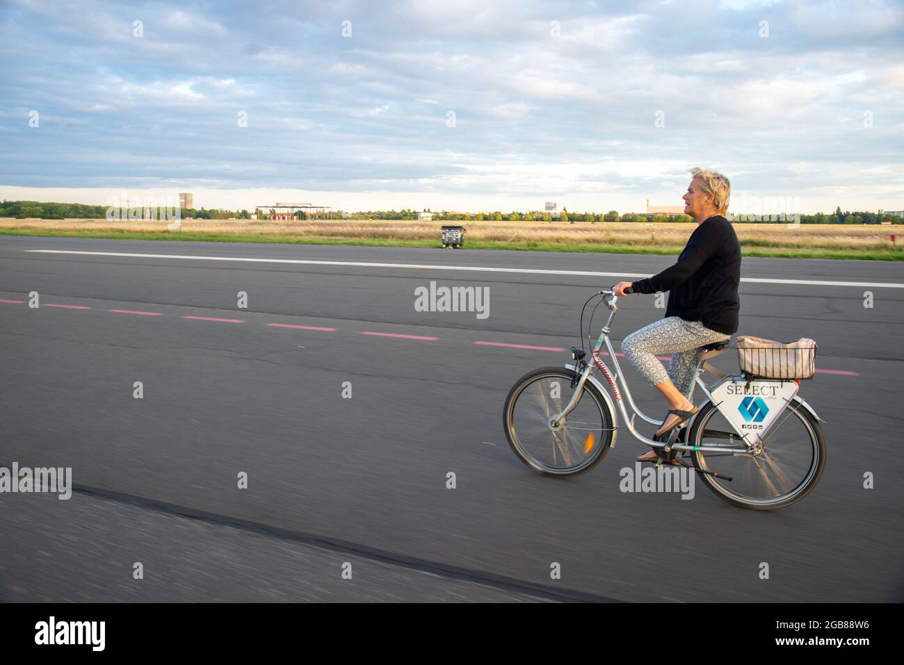 cyclists at former airport Tempelhof in Berlin, Germany Stock Photo
