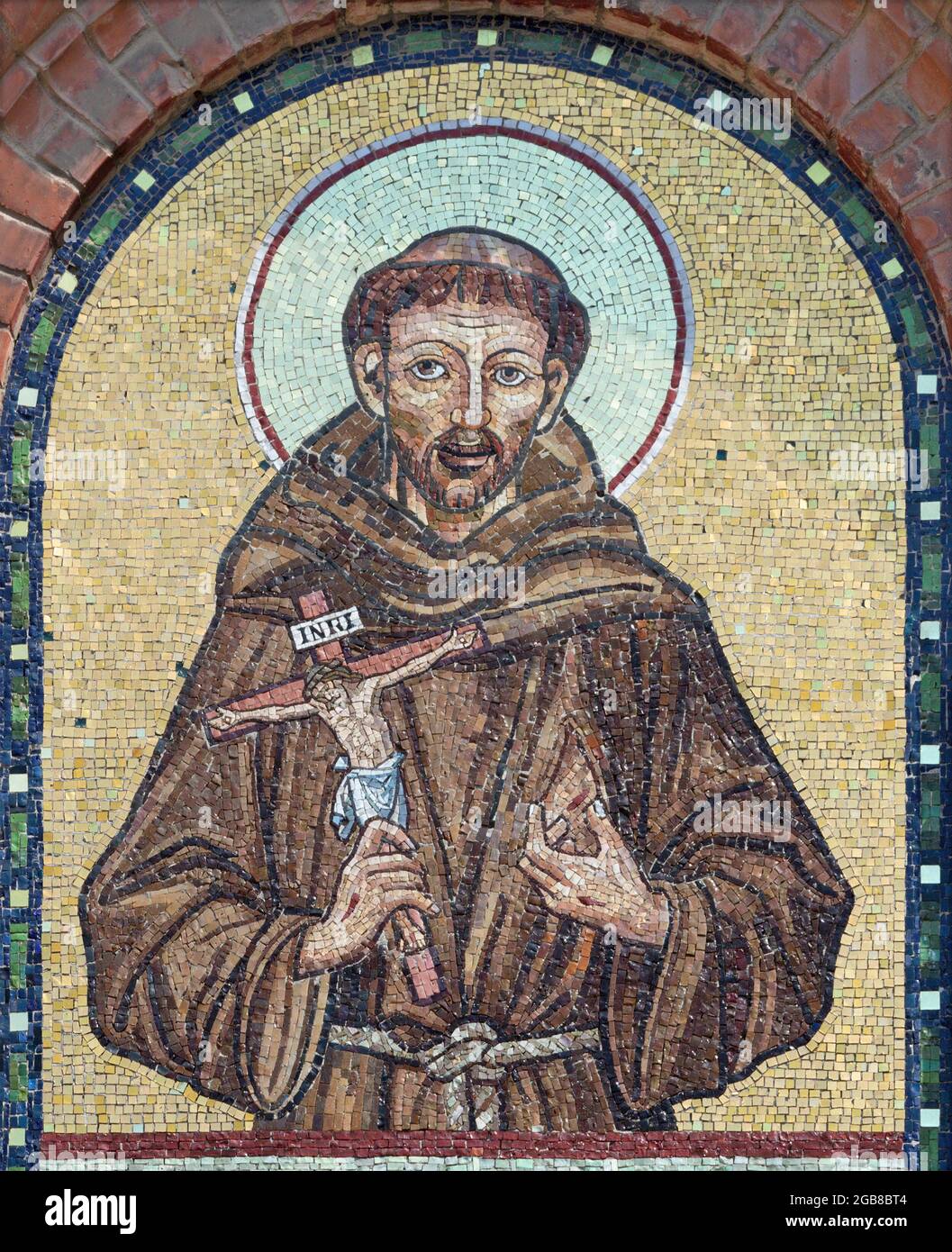 VIENNA, AUSTIRA - JULI 5, 2021: The mosaic of St. Francis of Assisi of the west church on the facade of St. Anthony church from begin of 20. cent.. Stock Photo