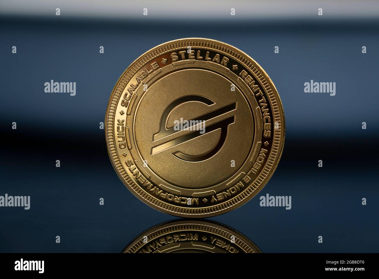 Stellar XLM Lumens Cryptocurrency physical coin placed on the reflective  blue surface Stock Photo - Alamy