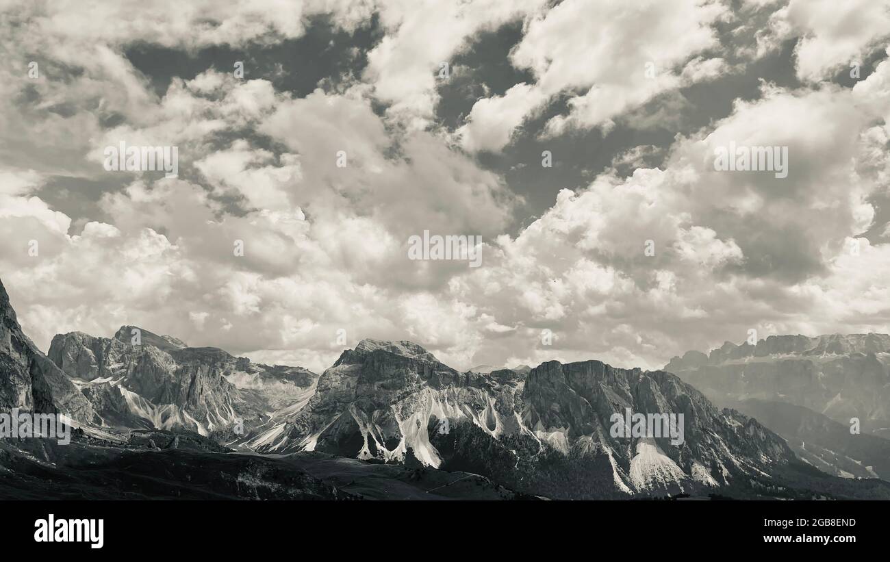 Mountain peaks under the sky with clouds Dolomites Italy Stock Photo ...