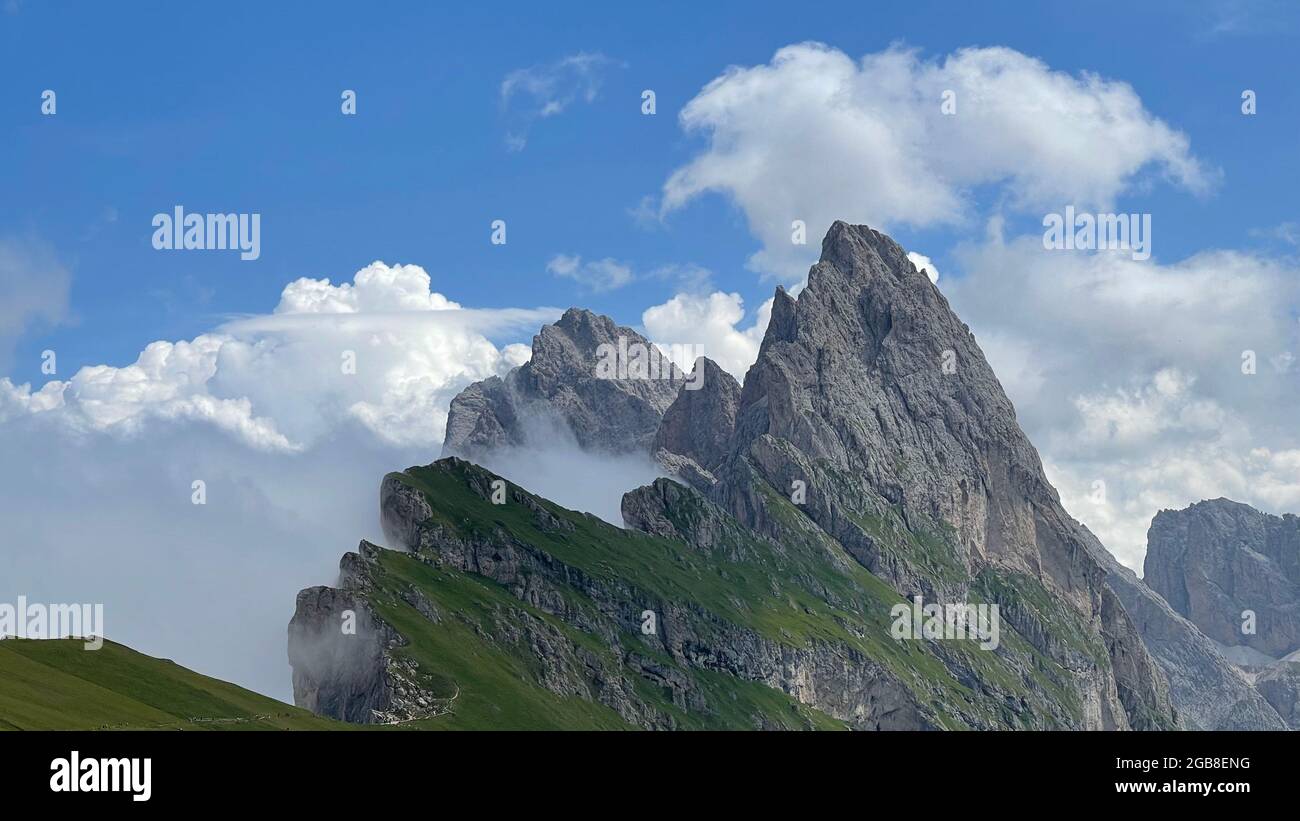 Mountain peaks under the sky with clouds Dolomites Italy Stock Photo ...