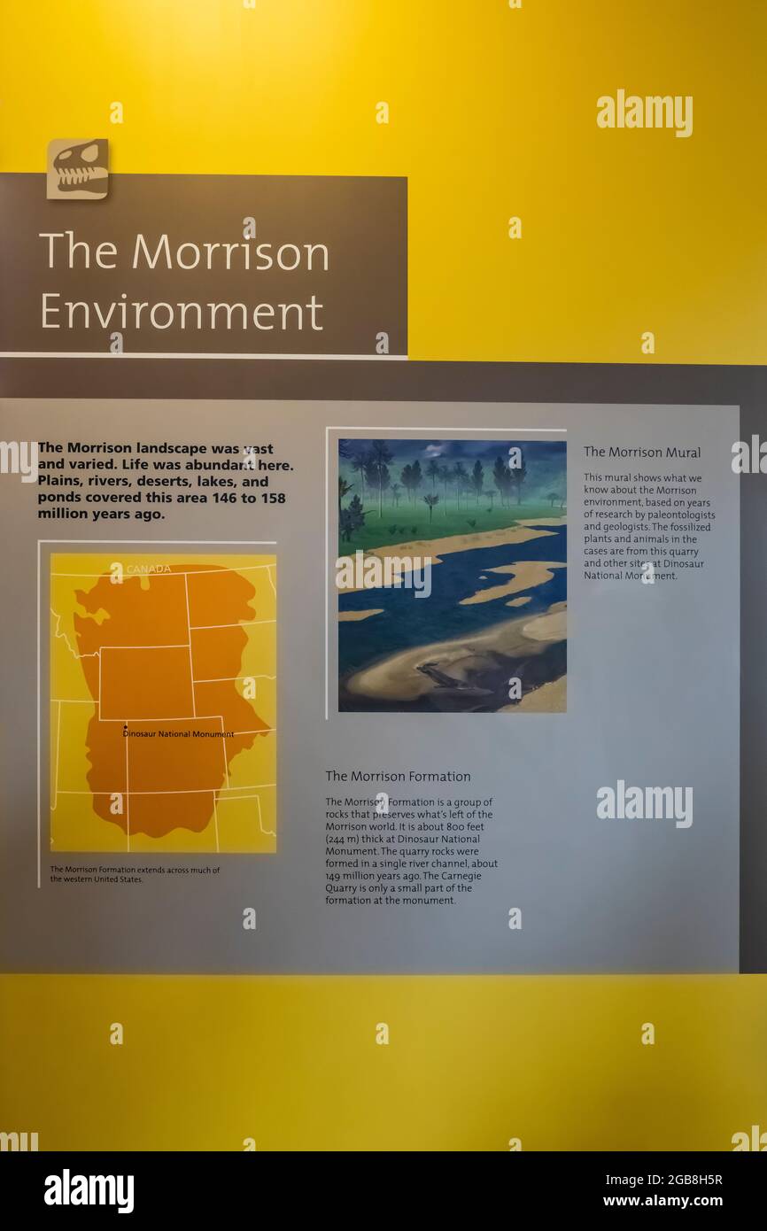 Sign examining original environment of the Morrison Formation, within Quarry Exhibit Hall in Dinosaur National Monument on border of Utah and Colorado Stock Photo