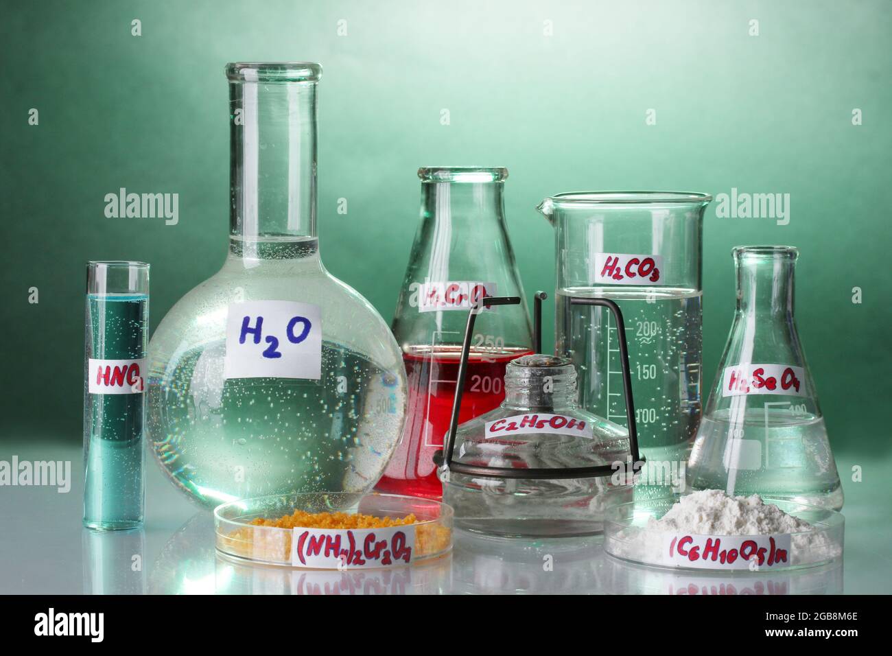 Test-tubes with various acids and chemicals on bright background Stock ...