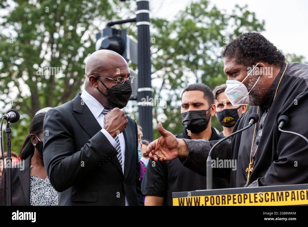 Washington, DC, USA, 2 August 2021.  Pictured: Rev. William Barber welcomes Senator Raphael Warnock (D-GA) during the Moral Monday March in Washington, DC, sponsored by the Poor People’s Campaign, Kairos Center, and Repairers of the Breach.  Credit: Allison Bailey / Alamy Live News Stock Photo