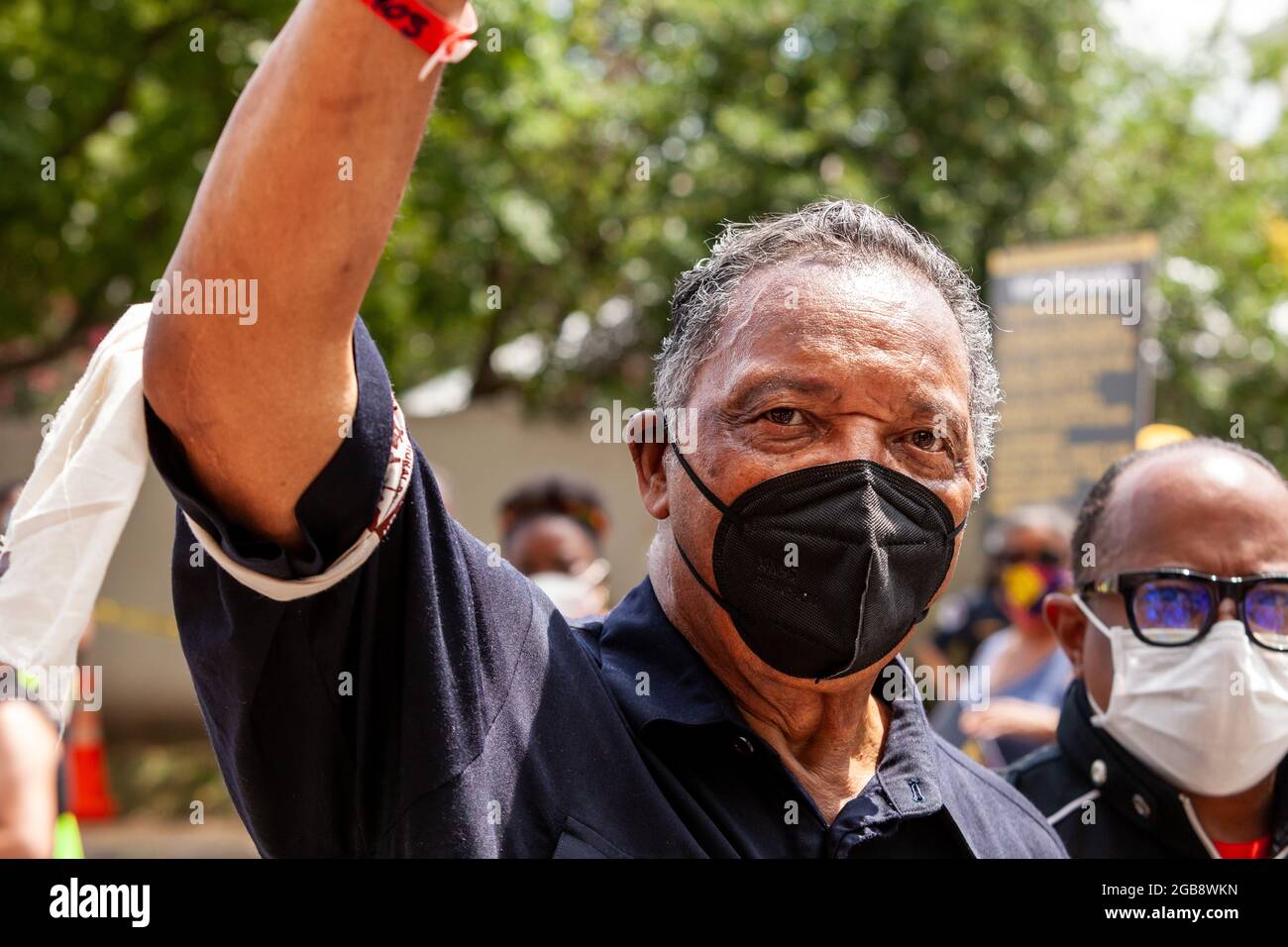 Washington, DC, USA, 2 August 2021.  Pictured: Rev. Jesse Jackson waves to supporters when he is released following a civil disobedience action with the Moral Monday March.  Protesters blocked the street in front of The Hart Senate Building, resulting in arrest by Capitol Police.  The march is sponsored by the Poor People’s Campaign, Kairos Center, and Repairers of the Breach.  Credit: Allison Bailey / Alamy Live News Stock Photo