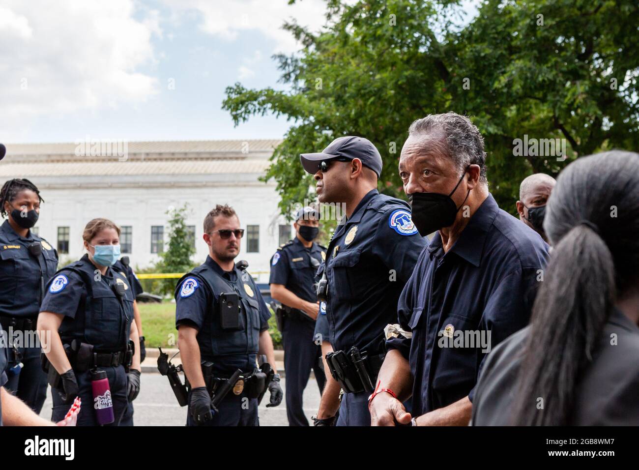 Washington, DC, USA, 2 August 2021.  Pictured: Rev. Jesse Jackson is arrested by Capitol Police while participating in a civil disobedience action during the Moral Monday March.  Protesters blocked the street in front of the Hart Senate Building, leading to the arrest of hundreds.  The march was sponsored by the Poor People’s Campaign, Kairos Center, and Repairers of the Breach.  Credit: Allison Bailey / Alamy Live News Stock Photo