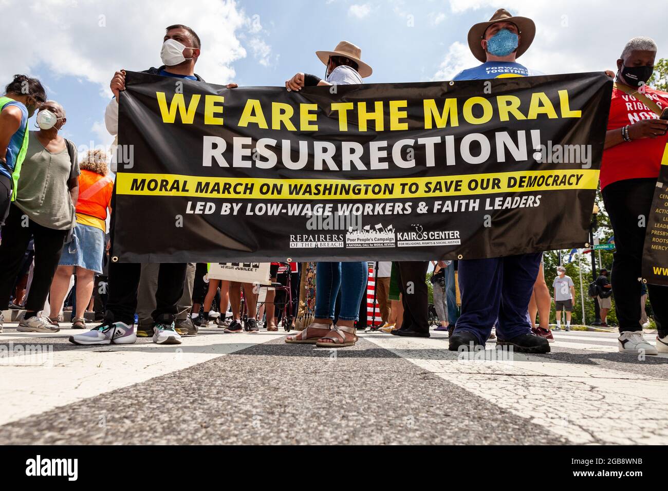 Washington, DC, USA, 2 August 2021.  Pictured: Protesters carry a banner during a Moral Monday march emphasizing one purpose of the event: preservation of democracy in the United States.  The march was sponsored by the Poor People’s Campaign, Kairos Center, and Repairers of the Breach.  Credit: Allison Bailey / Alamy Live News Stock Photo