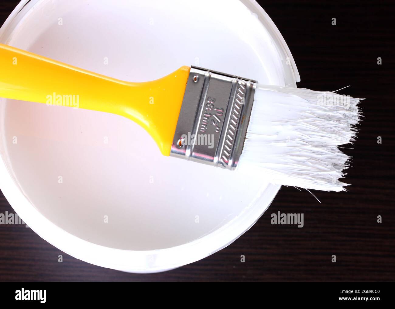 Paint brush and opened can of white paint Stock Photo Alamy