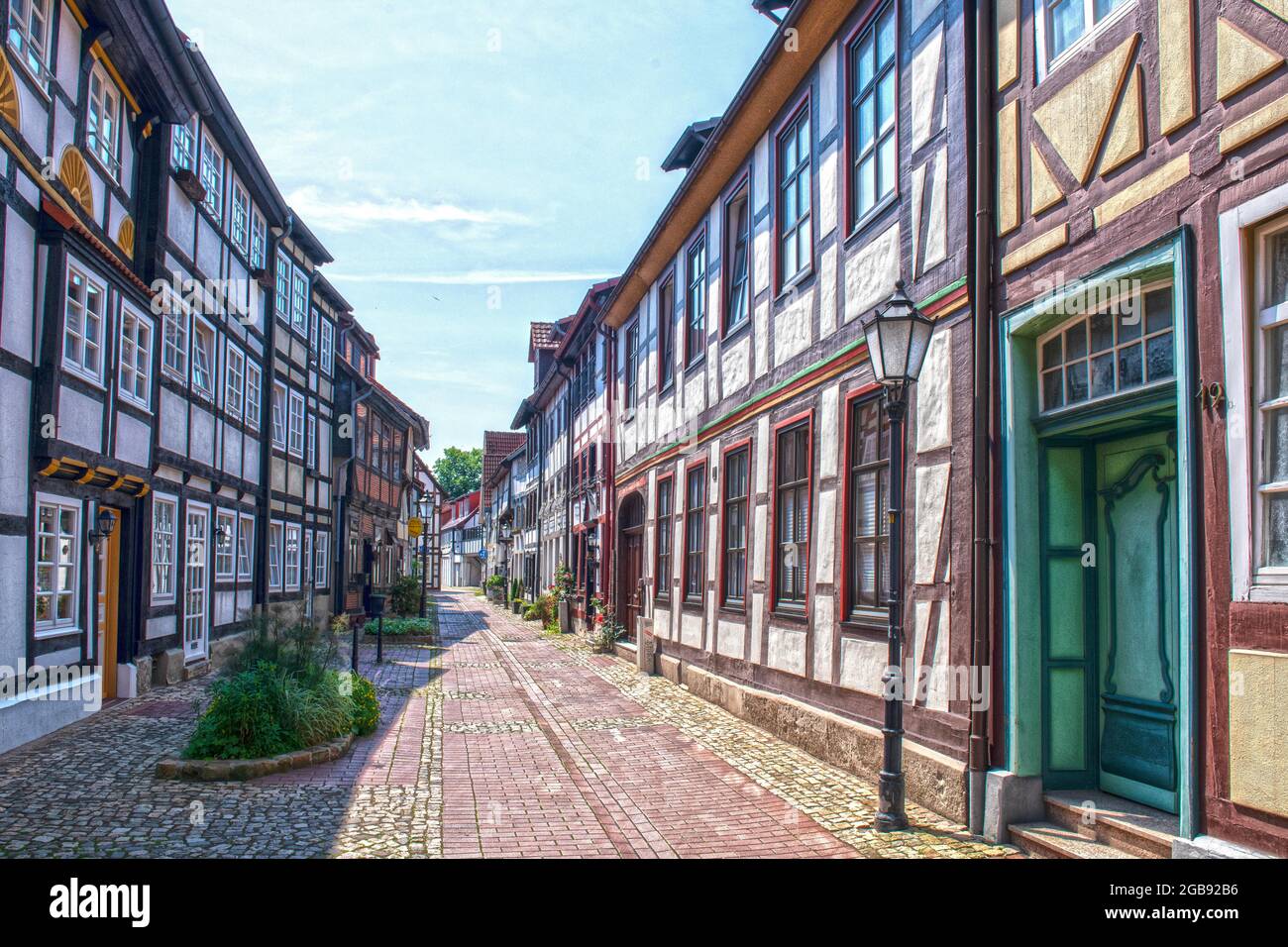 Hisâ€ oric half-timbered houses in small old town alley, Hamelin, Lower Saxony, Germany Stock Photo