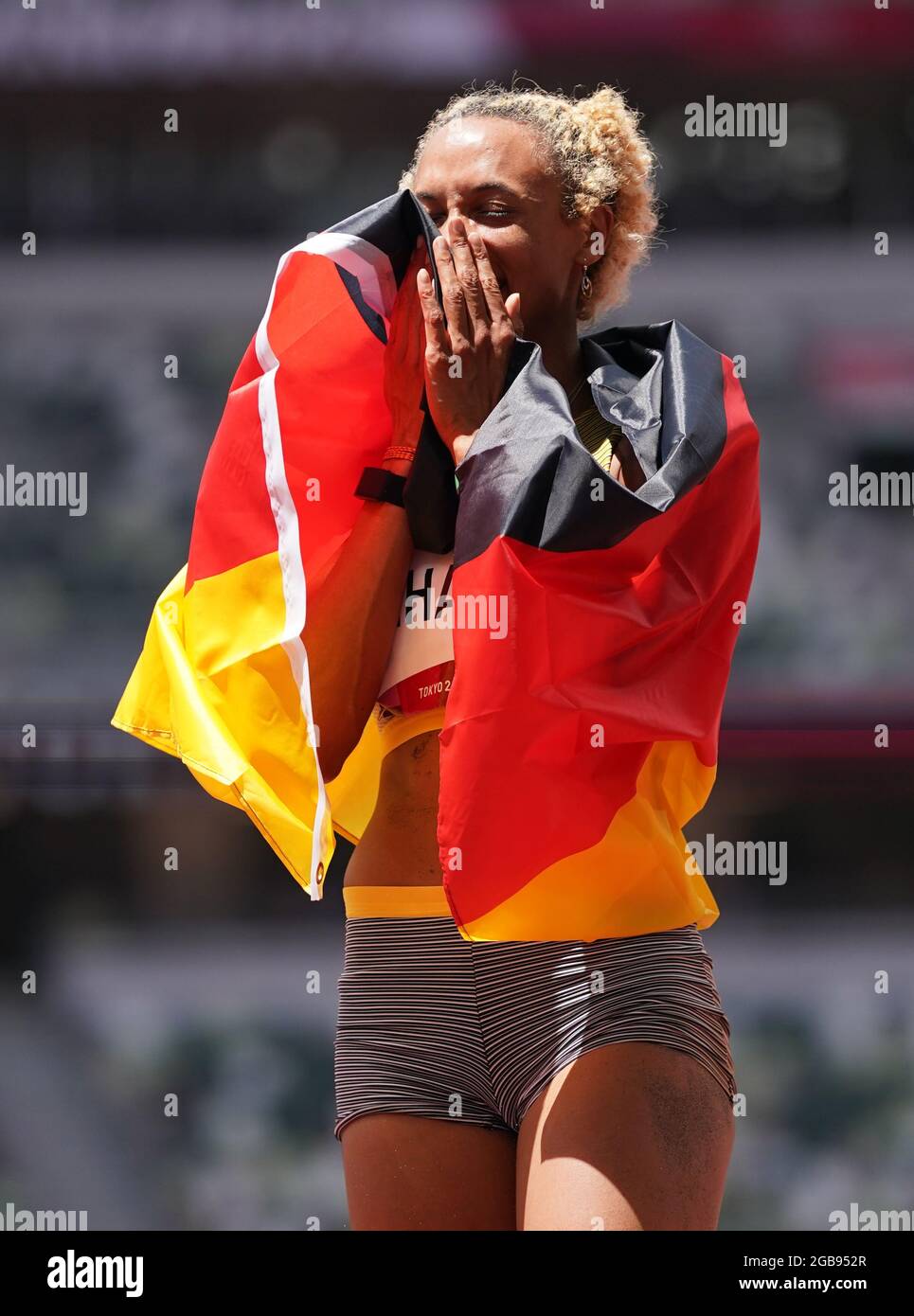 Germany's Malaika Mihambo celebrates winning the gold medal in the