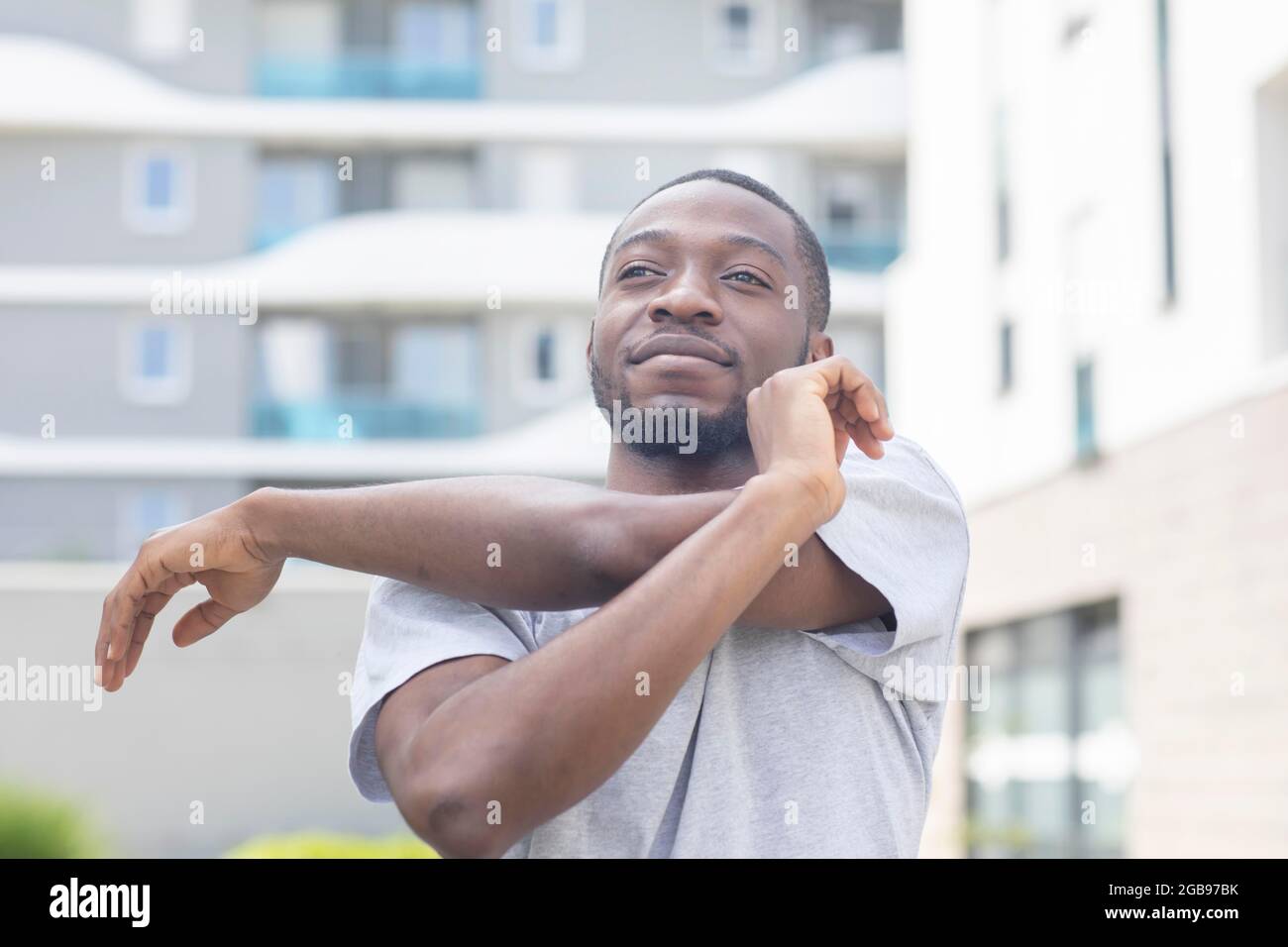 Young black man doing fitness in the summer of the city, Freiburg, Baden-Wuerttemberg, Germany Stock Photo