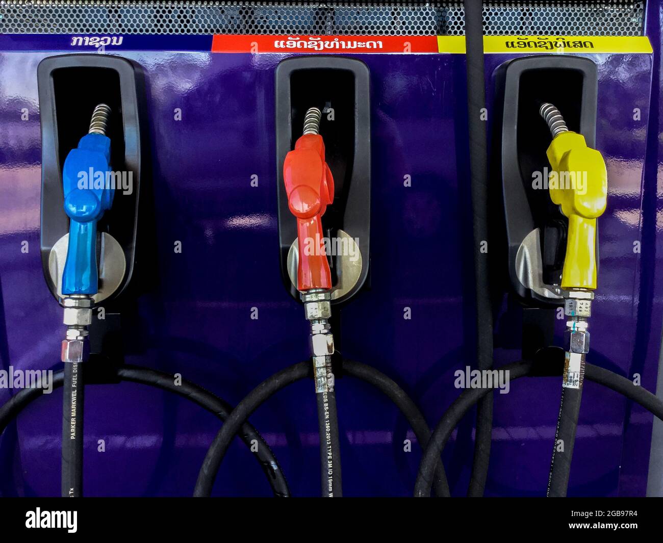 Fuel nozzles for different types of gas or petrol at a gas station in Laos Stock Photo Alamy