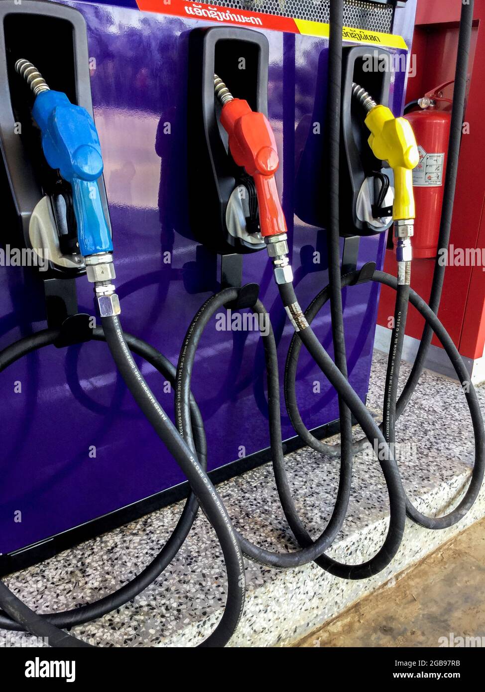 Fuel nozzles for different types of gas or petrol at a gas station in Laos Stock Photo Alamy