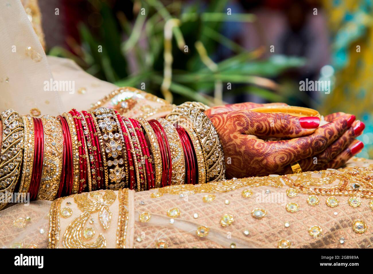 Traditional bridal jewelry and henna decoration on the hands of a bride