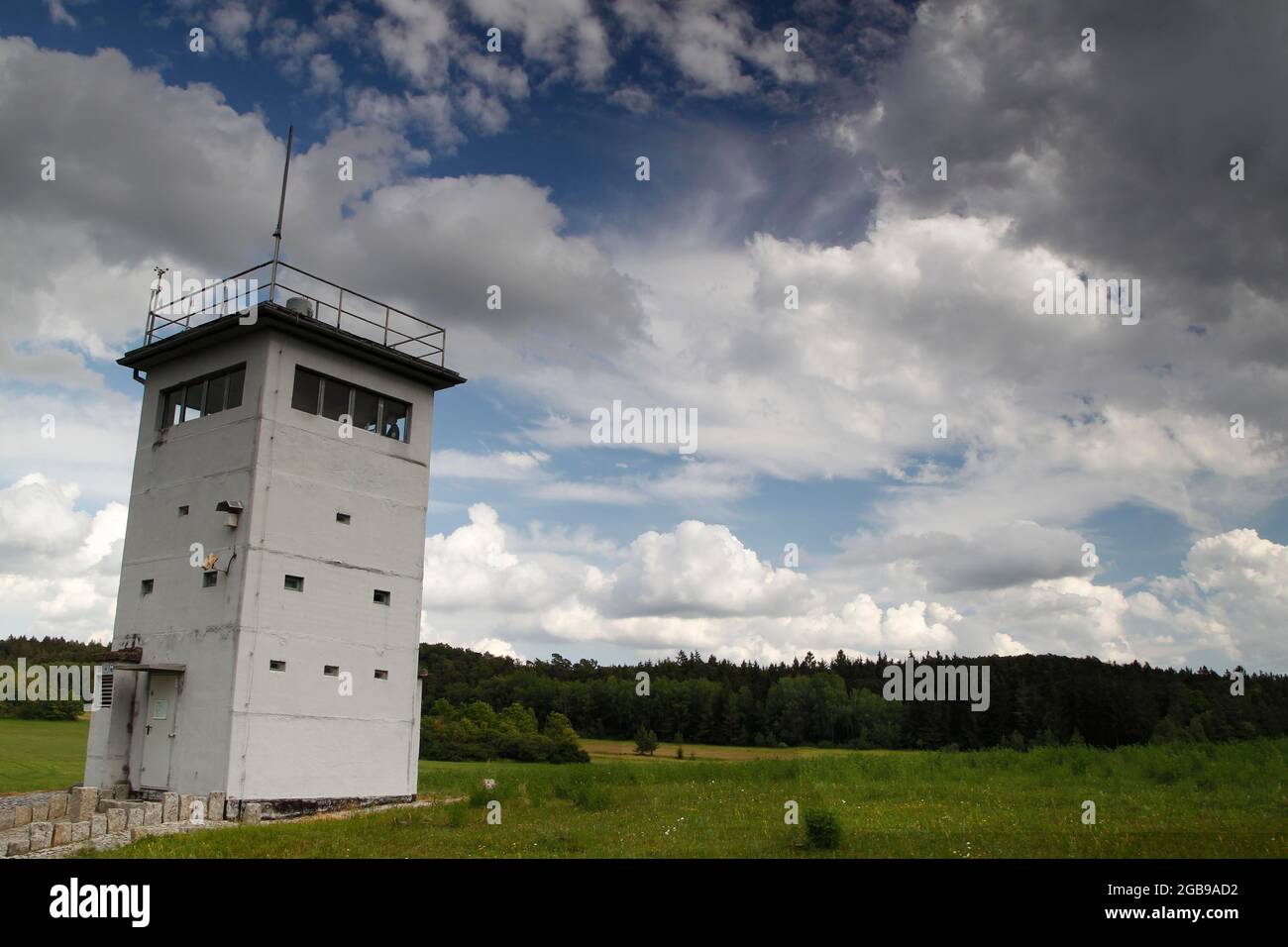 Observation tower of the GDR border troops, border watchtower, guiding tower, column trail, hiking trail through meadows and woodland, perforated Stock Photo