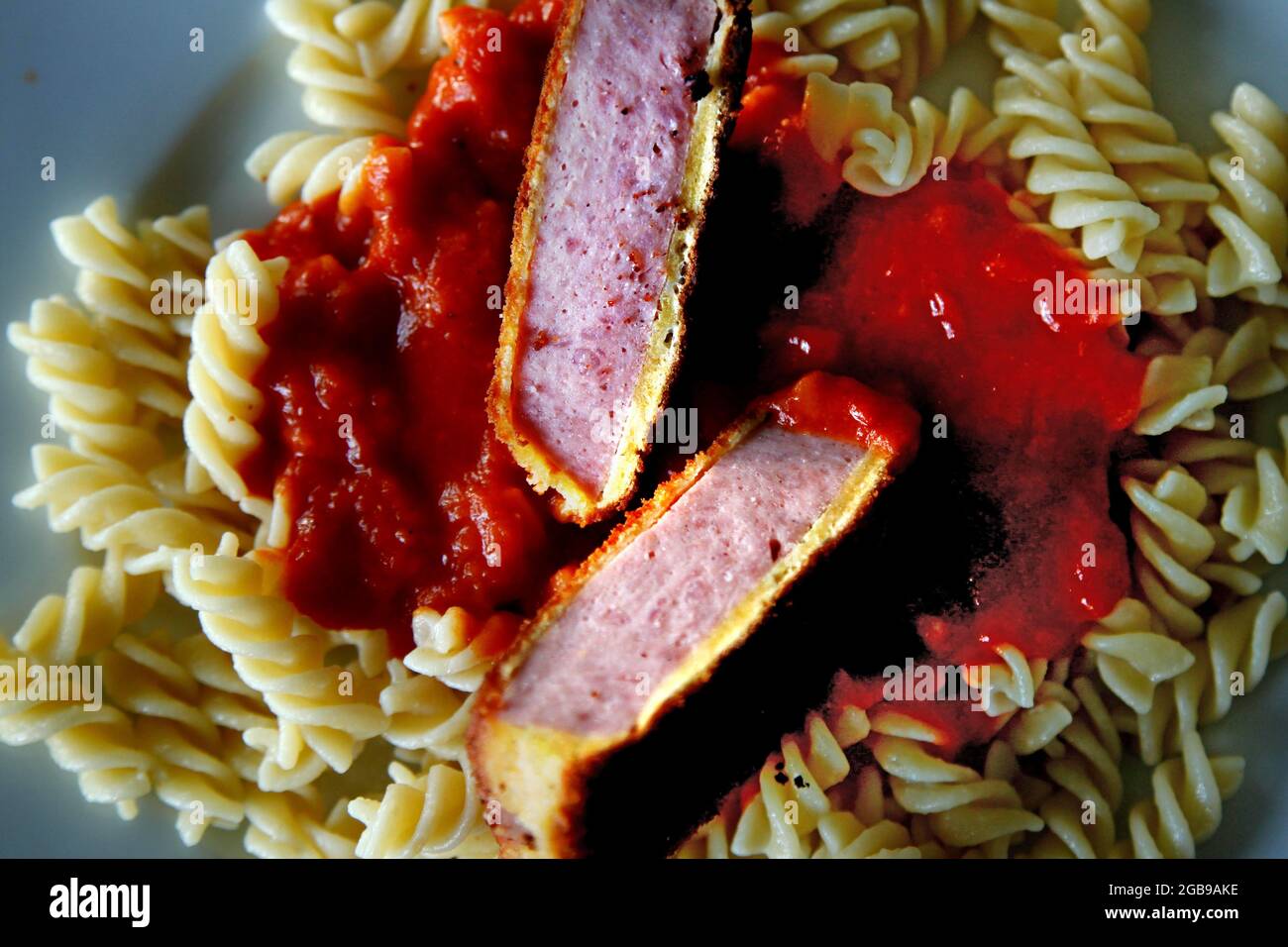 Jaegerschnitzel with spirelli noodles and tomato sauce, GDR cuisine
