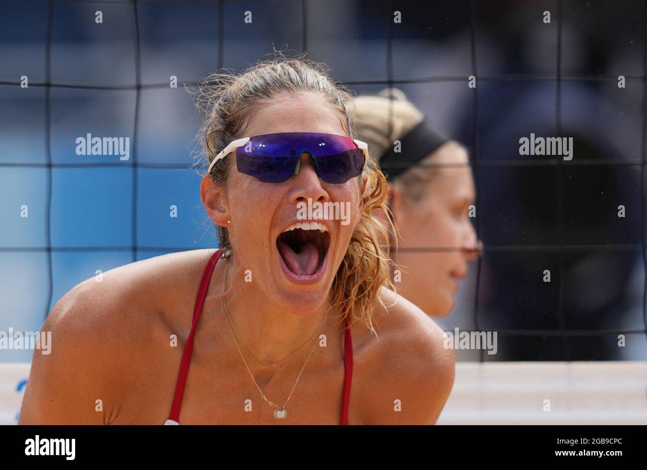 Tokyo, Japan. 3rd Aug, 2021. April Ross of the United States celebrates scoring during the women's quarterfinal match of beach volleyball between Germany's Laura Ludwig/Margareta Kozuch and April Ross/Alix Klineman of the United States at the Tokyo 2020 Olympic Games in Tokyo, Japan, Aug. 3, 2021. Credit: Li He/Xinhua/Alamy Live News Stock Photo