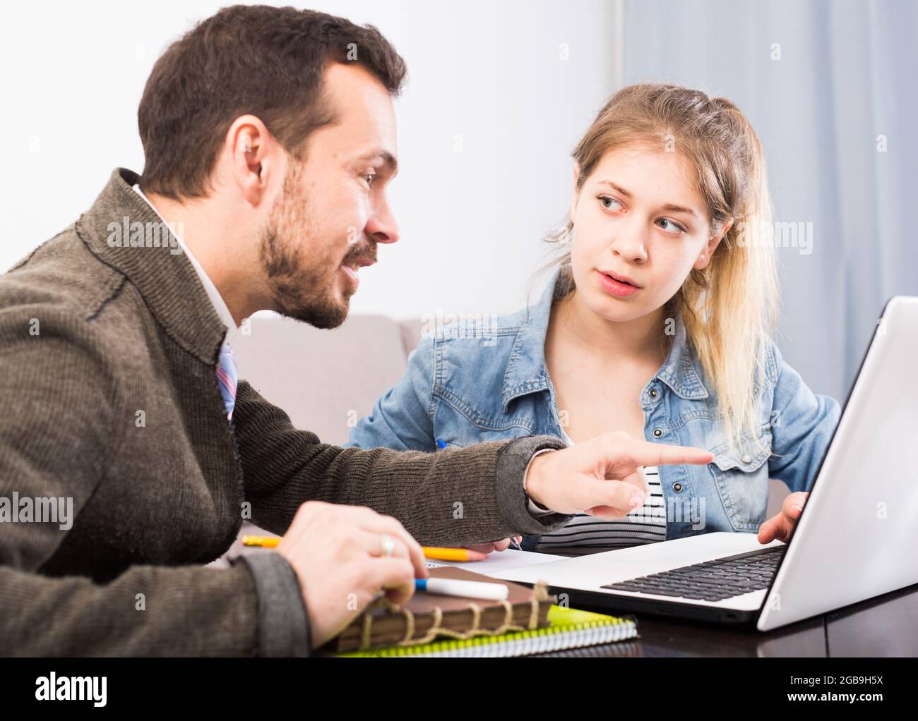 Tutor and teenage client Stock Photo - Alamy