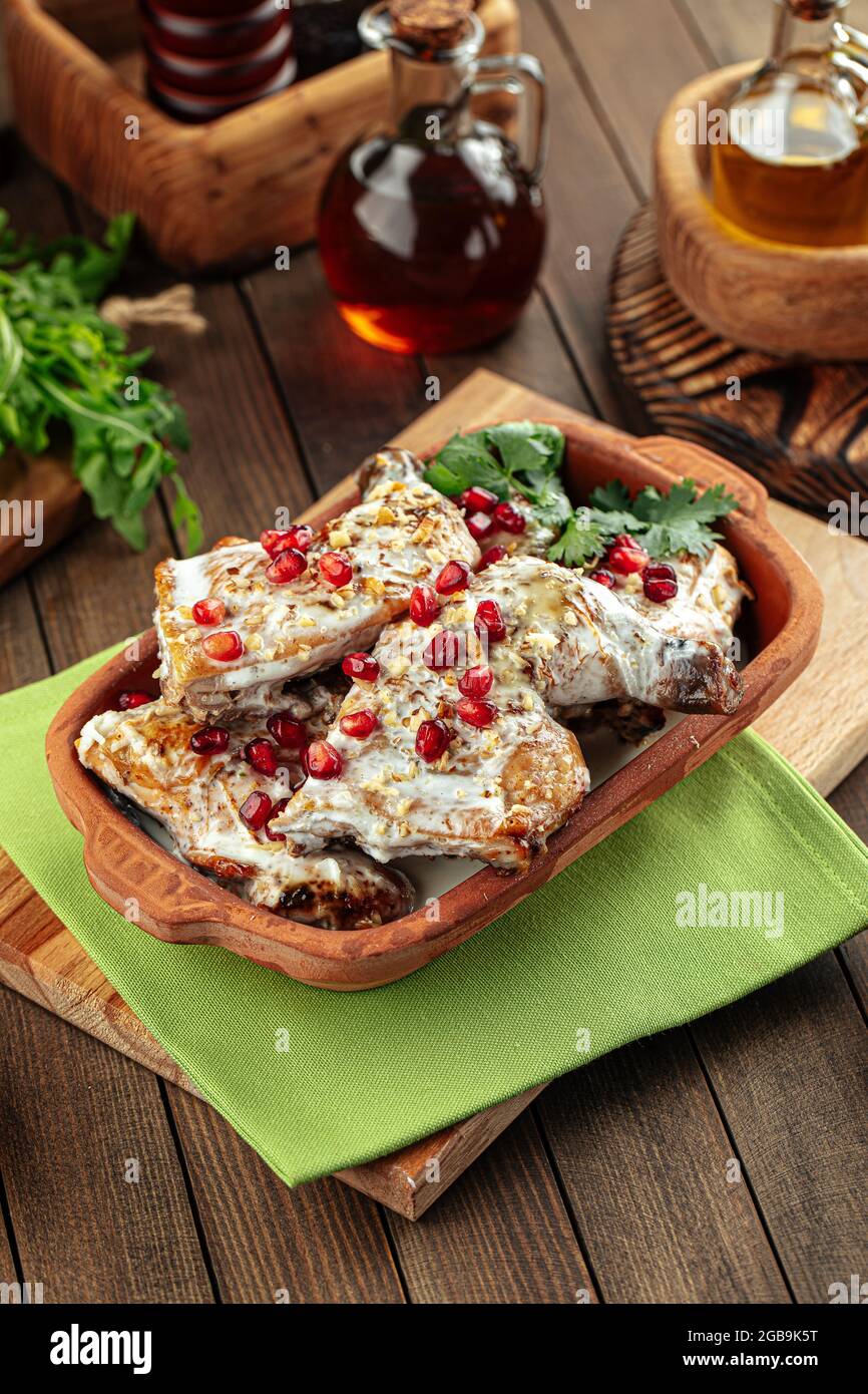 Georgian dish chkmeruli chicken with cream Stock Photo