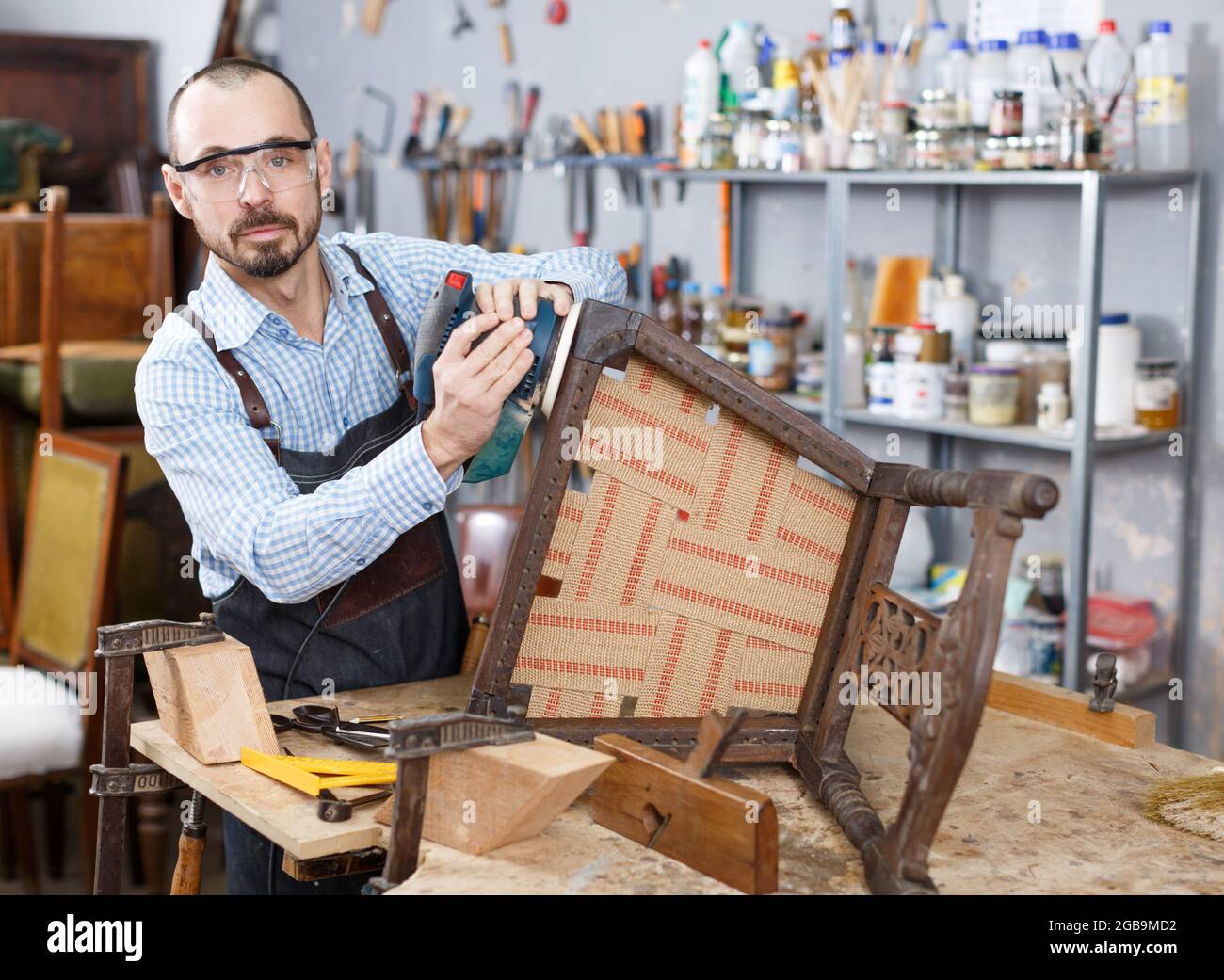 Furniture restorer renovation antique chair Stock Photo Alamy