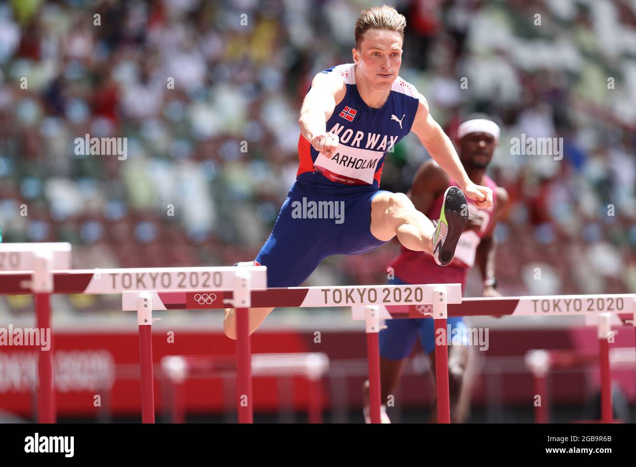 Karsten WARHOLM (NOR) wins the Men's 400m Hurdles Final in a new World