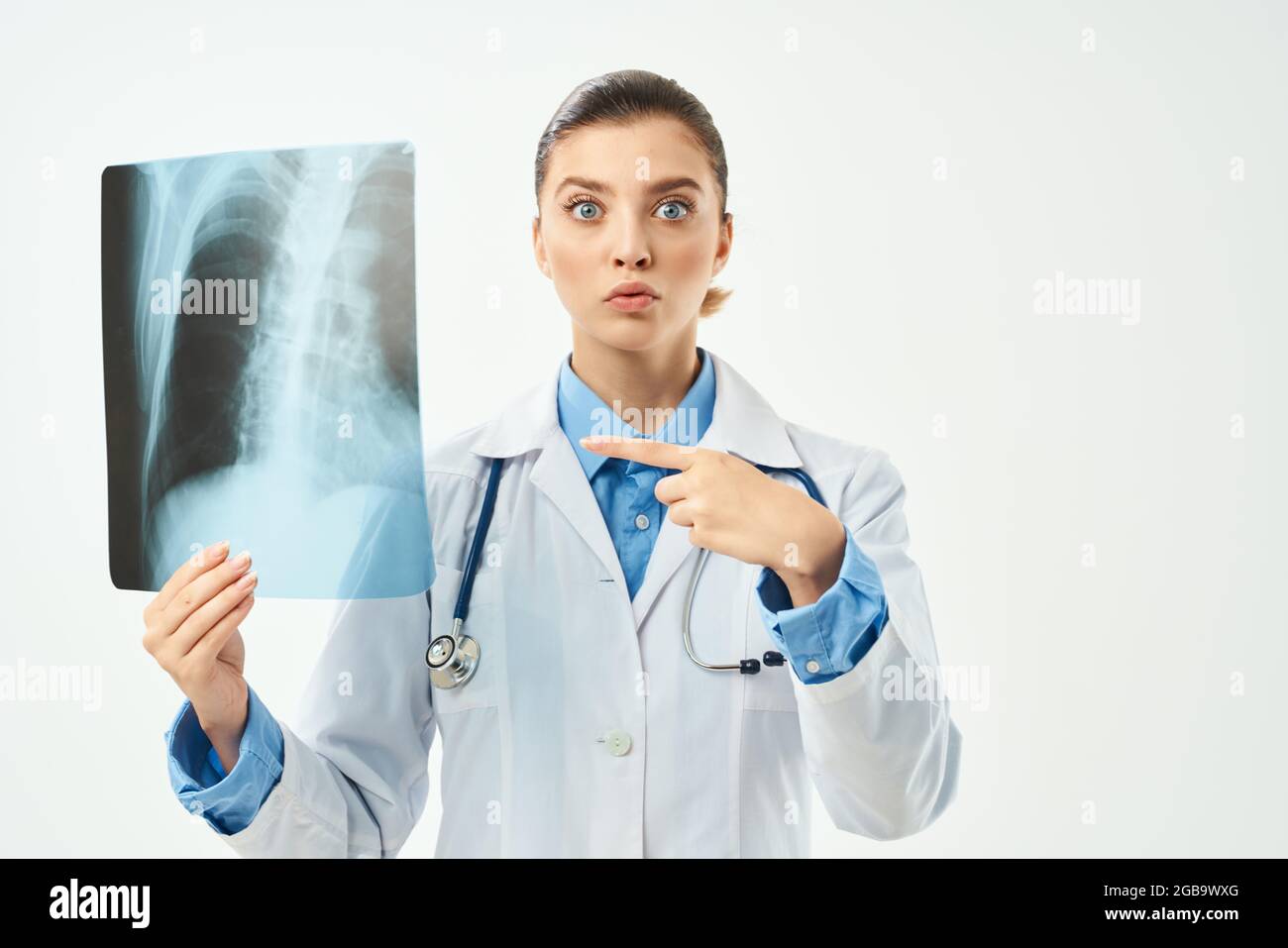 surprised radiologist showing x-ray emotion light background Stock ...