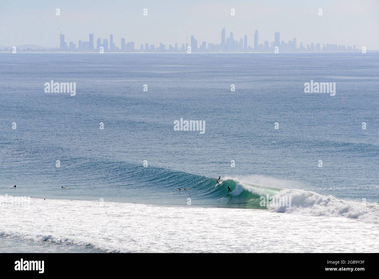 People surfing in Kirra, Gold Coast, Australia Stock Photo