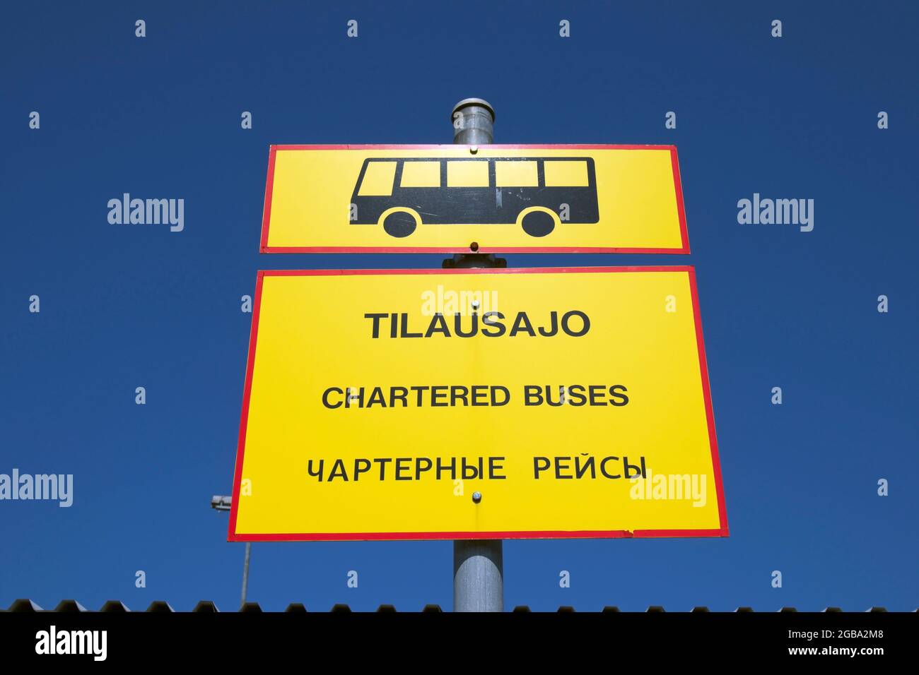 charter-bus-traffic-sign-with-finnish-english-and-russian-text-stock