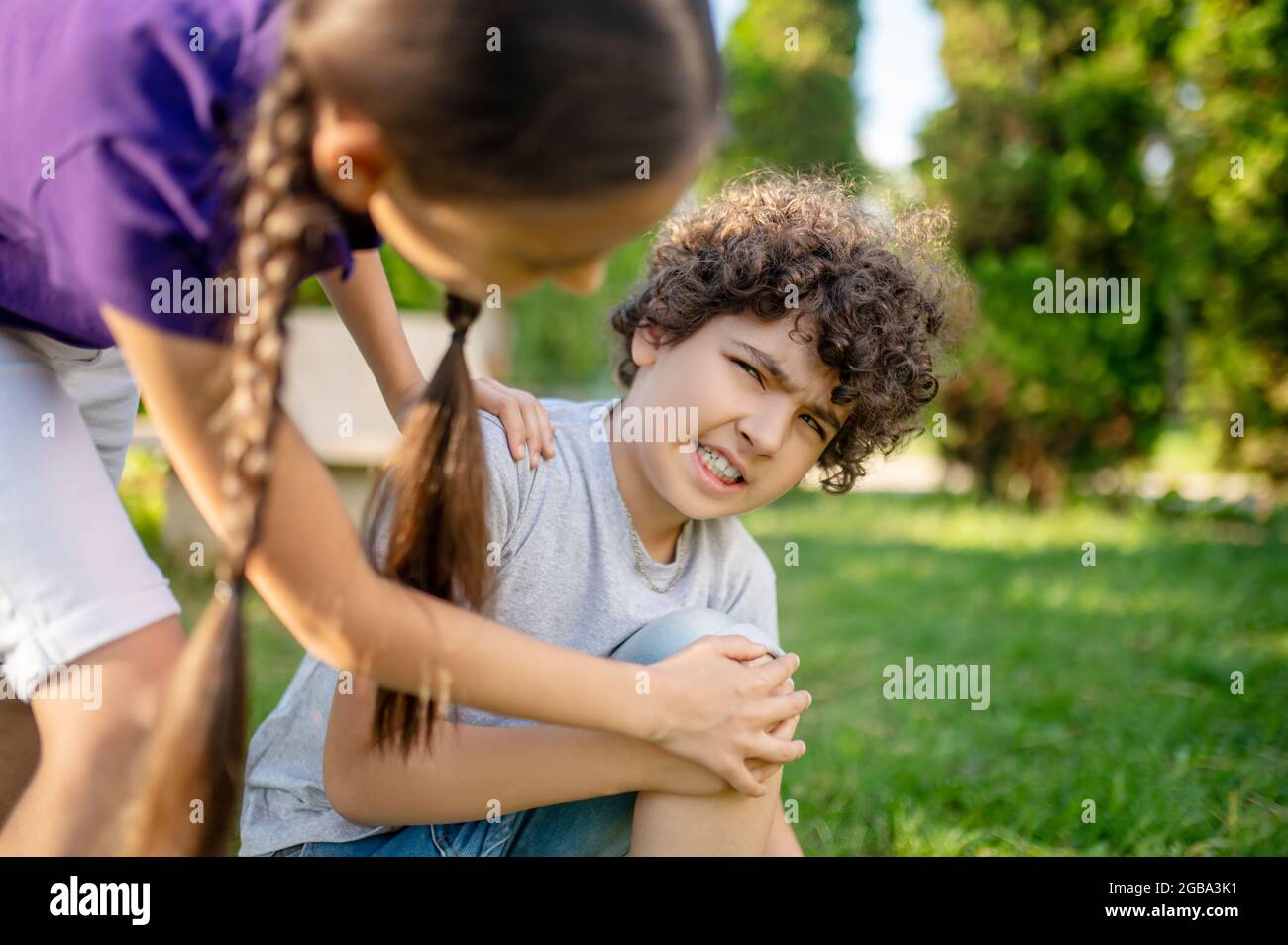 Boy With Grimace Touching His Knee And Girlfriend Stock Photo Alamy skin-making-pt-1-tips