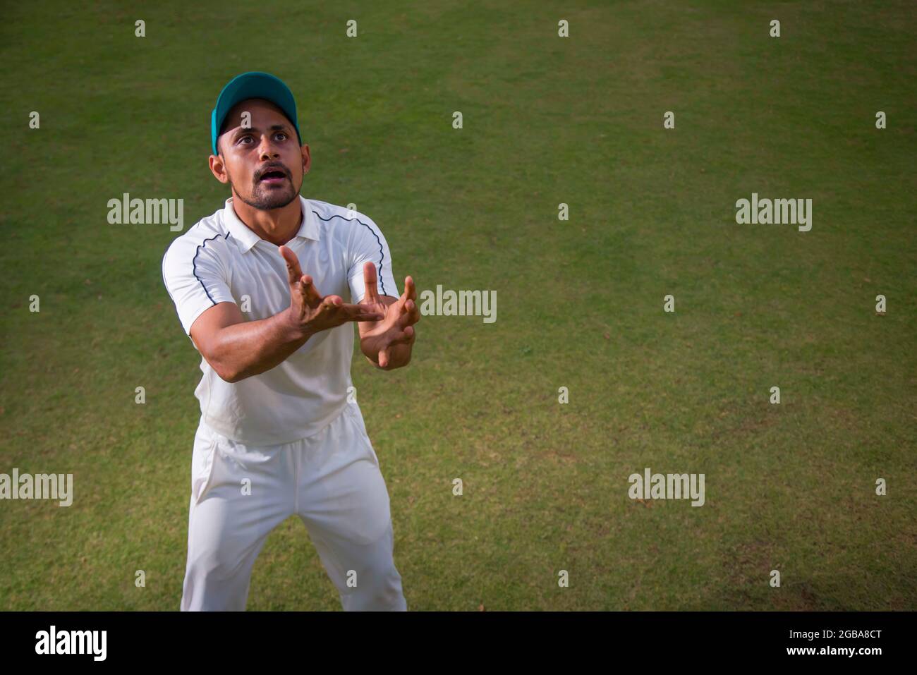 Fielder waiting to catch a ball in the Ground Stock Photo Alamy