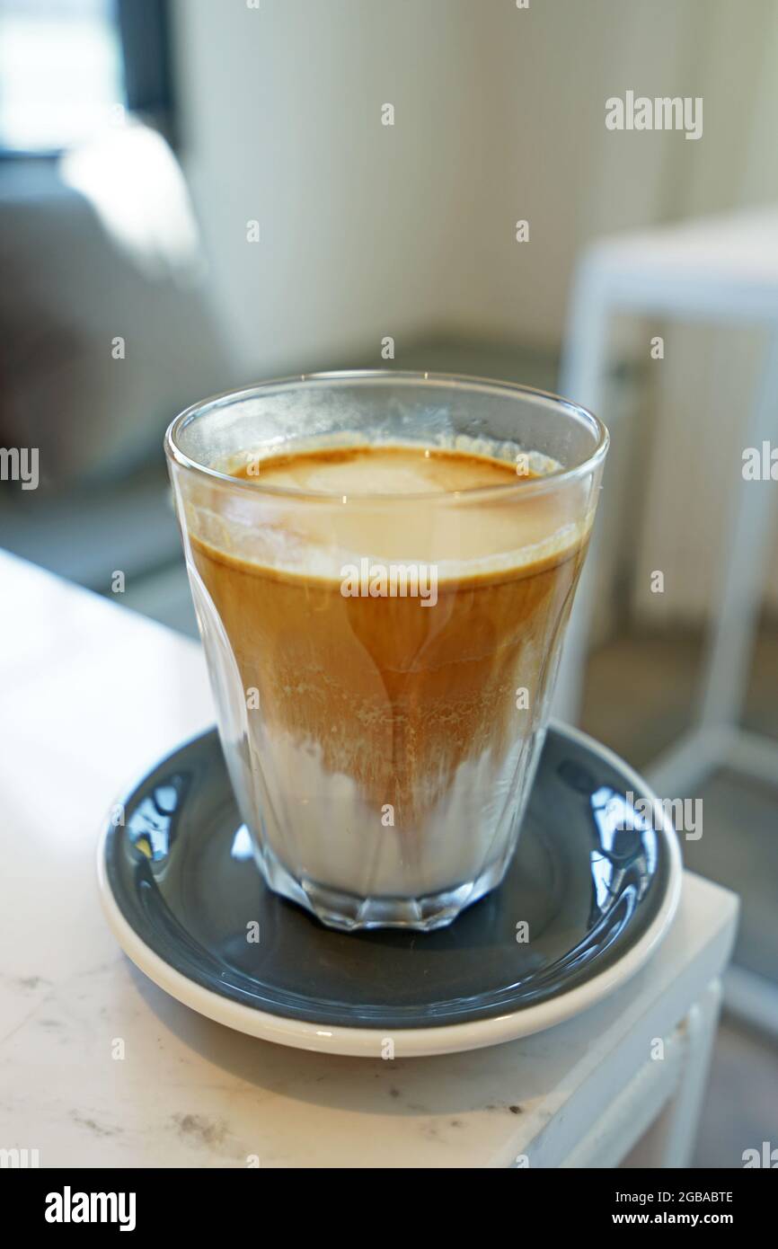 https://c8.alamy.com/comp/2GBABTE/close-up-glass-of-dirty-latte-coffee-2GBABTE.jpg