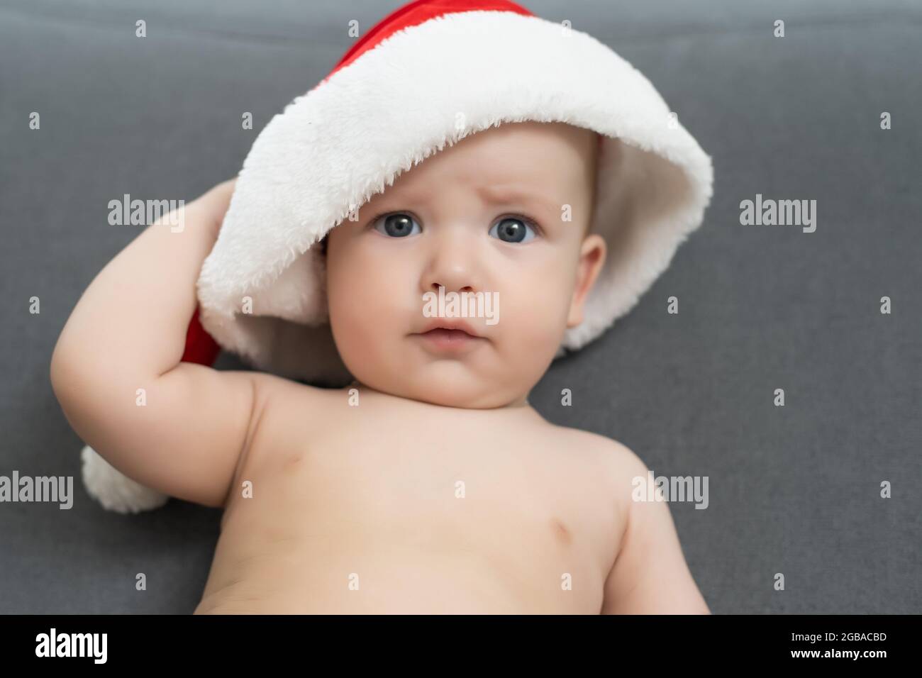 cute baby boy wearing christmas cap Stock Photo Alamy