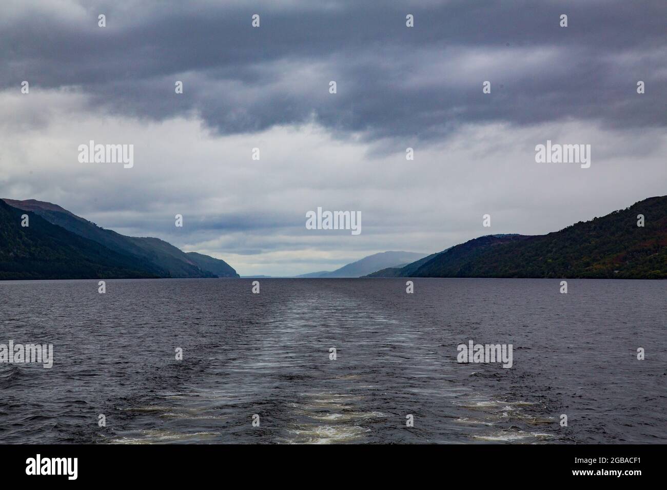 Mysterious Loch Ness with dark waters and picturesque shores lined with ...