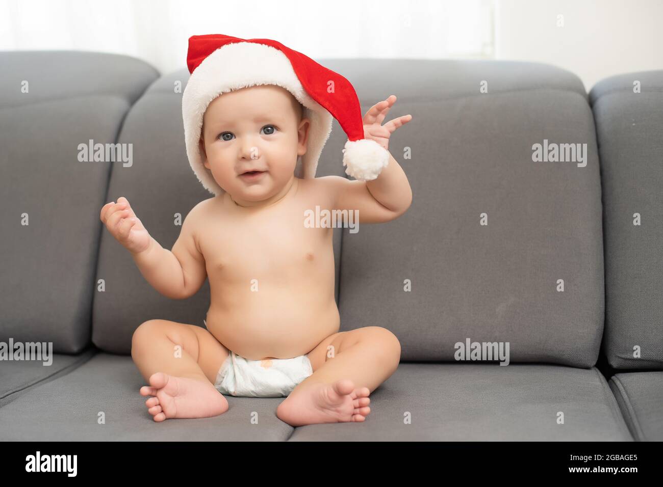 cute baby boy wearing christmas cap Stock Photo Alamy