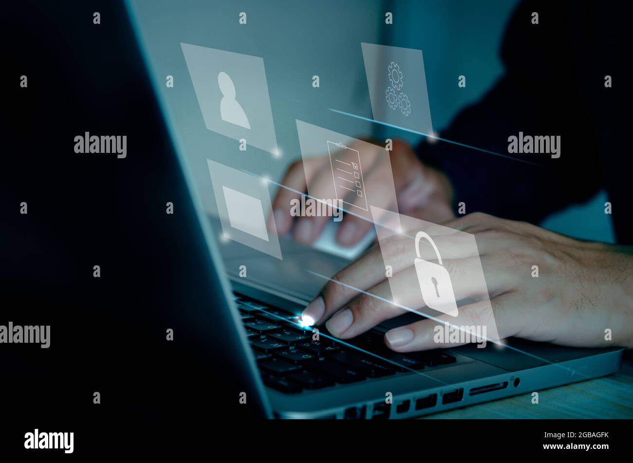Businessman using computer laptop document management concept working with icons on a virtual screen. Stock Photo