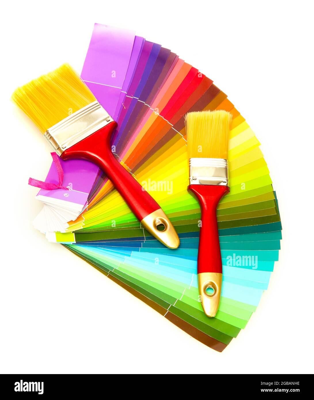 paint brushes and bright palette of colors isolated on white Stock