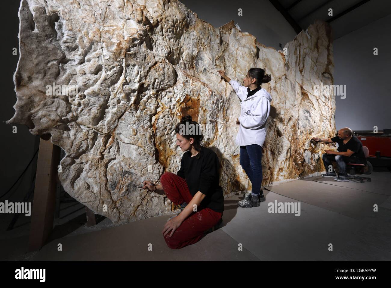 The Prehistorian and Plastician Alain Dalis is responsible for reproducing walls of the Cave Cosquer in his Montignac workshop. The Cosquer cave is an archeological treasure submerged in the creek of Marseille. This cave discovered in the 1990s by the diver Henri Cosquer includes more than 270 prehistoric works of arts, including unique representations of penguins, seals and Jellyfish.In reasons for the rise of waters of global warming this cave will disappear. The construction of its reply will remain in the future the only testimony of this treasure of humanity.Constructed in the building of Stock Photo