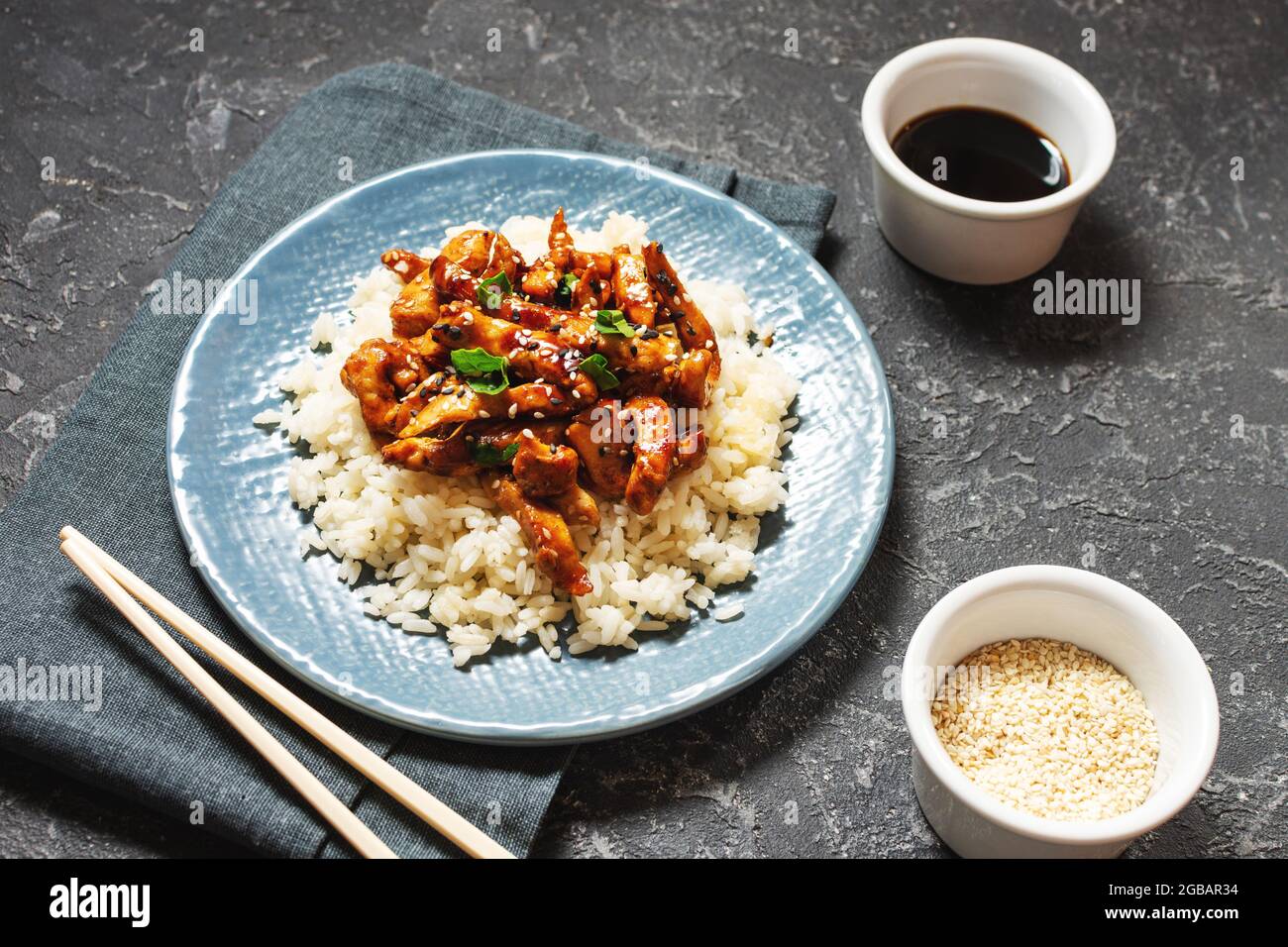 Homemade sesame Chicken served with Jasmine white rice, selective focus Stock Photo