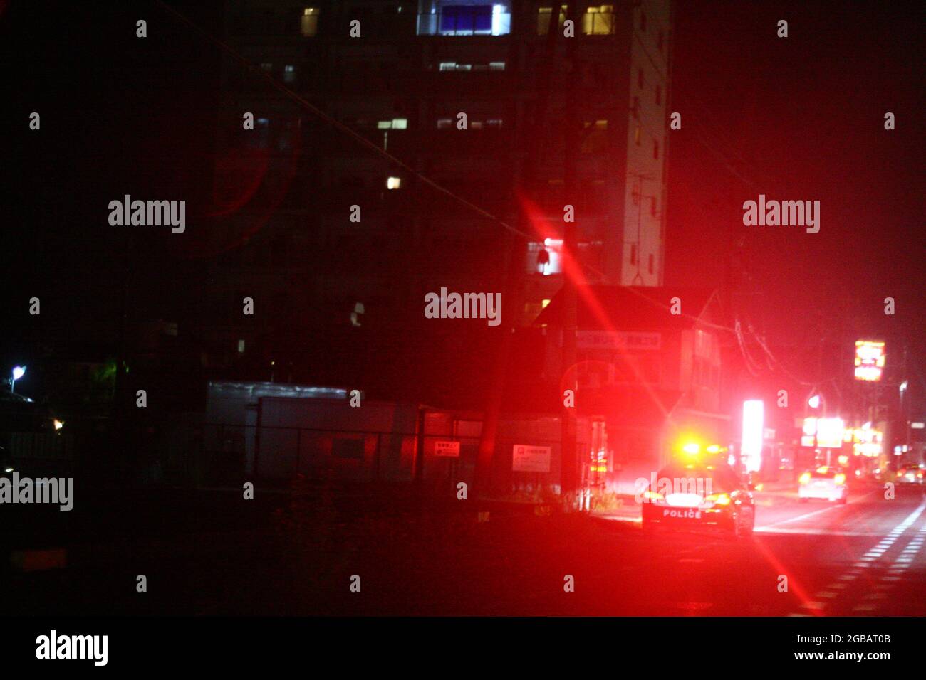 Cop Car in Japan at Night Stock Photo