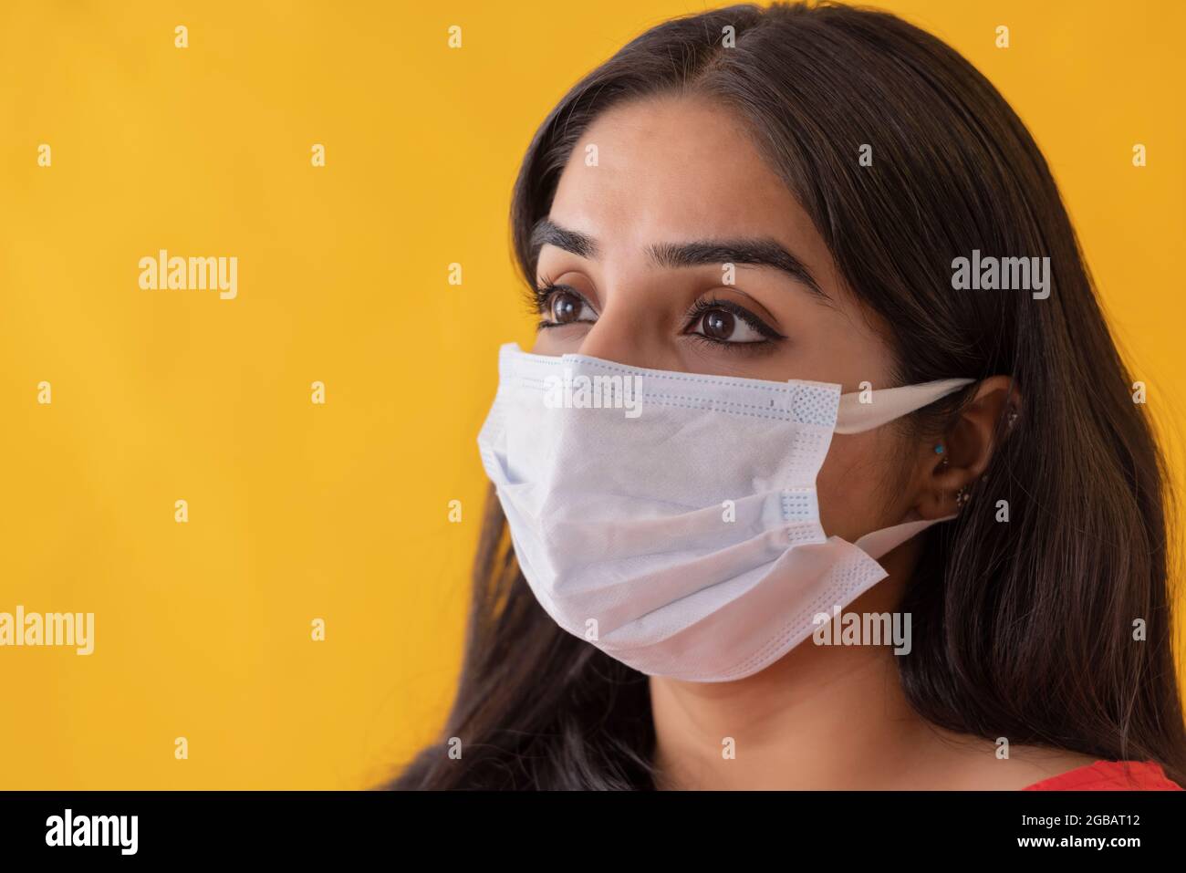 Gazing woman wearing mask hi-res stock photography and images - Alamy