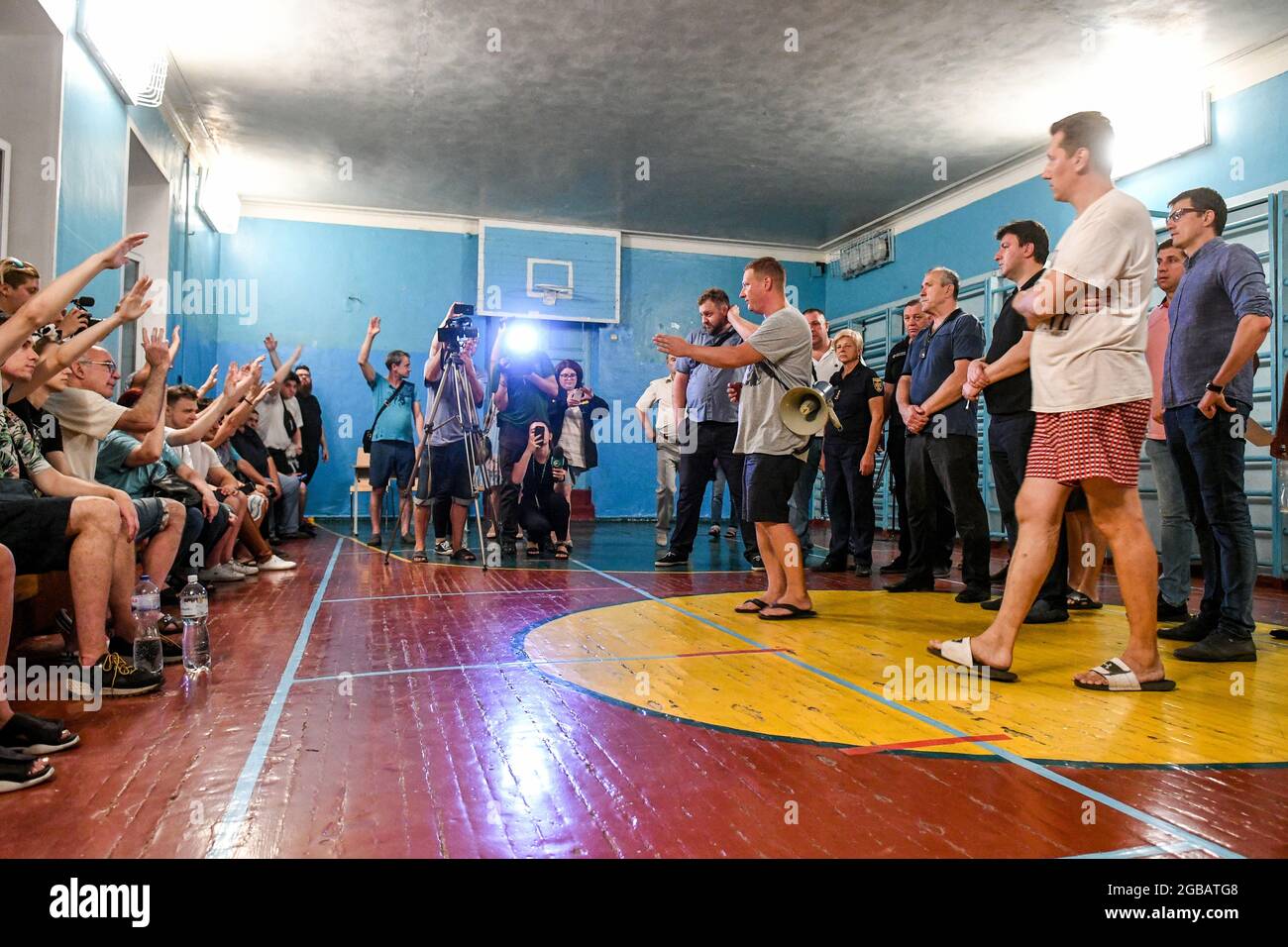 ZAPORIZHZHIA, UKRAINE - AUGUST 02, 2021 - People are seen at the headquarters for the consolidation of victims of fire in a 4-storey apartment buildin Stock Photo