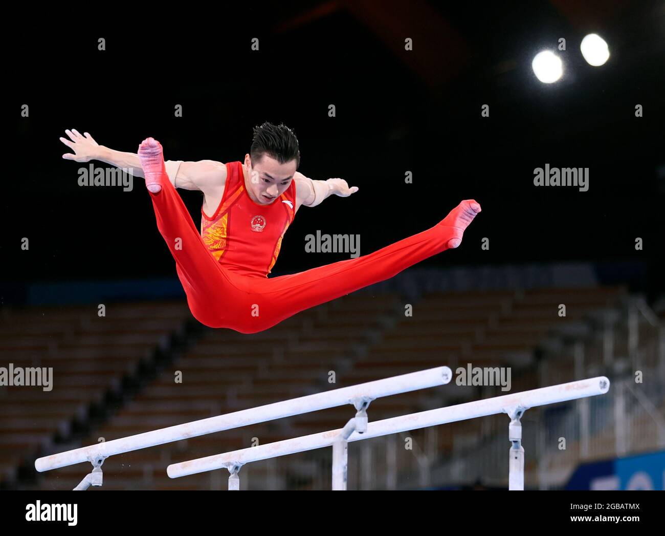 Tokyo, Japan. 3rd Aug, 2021. Zou Jingyuan of China competes during the artistic gymnastics men's parallel bars final at the Tokyo 2020 Olympic Games in Tokyo, Japan, Aug. 3, 2021. Credit: Lan Hongguang/Xinhua/Alamy Live News Stock Photo