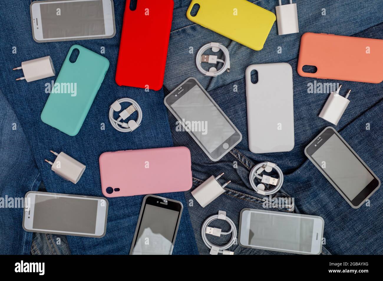 texture of mobile phone accessories on a denim background Stock Photo -  Alamy