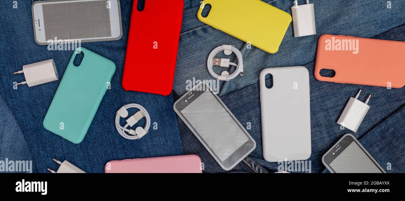 texture of mobile phone accessories on a denim background Stock Photo -  Alamy