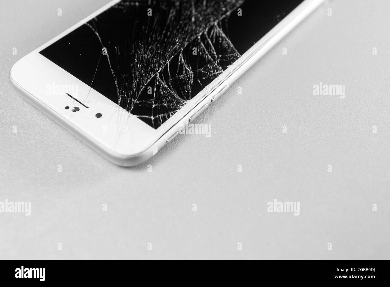 broken mobile phone display on a white background Stock Photo